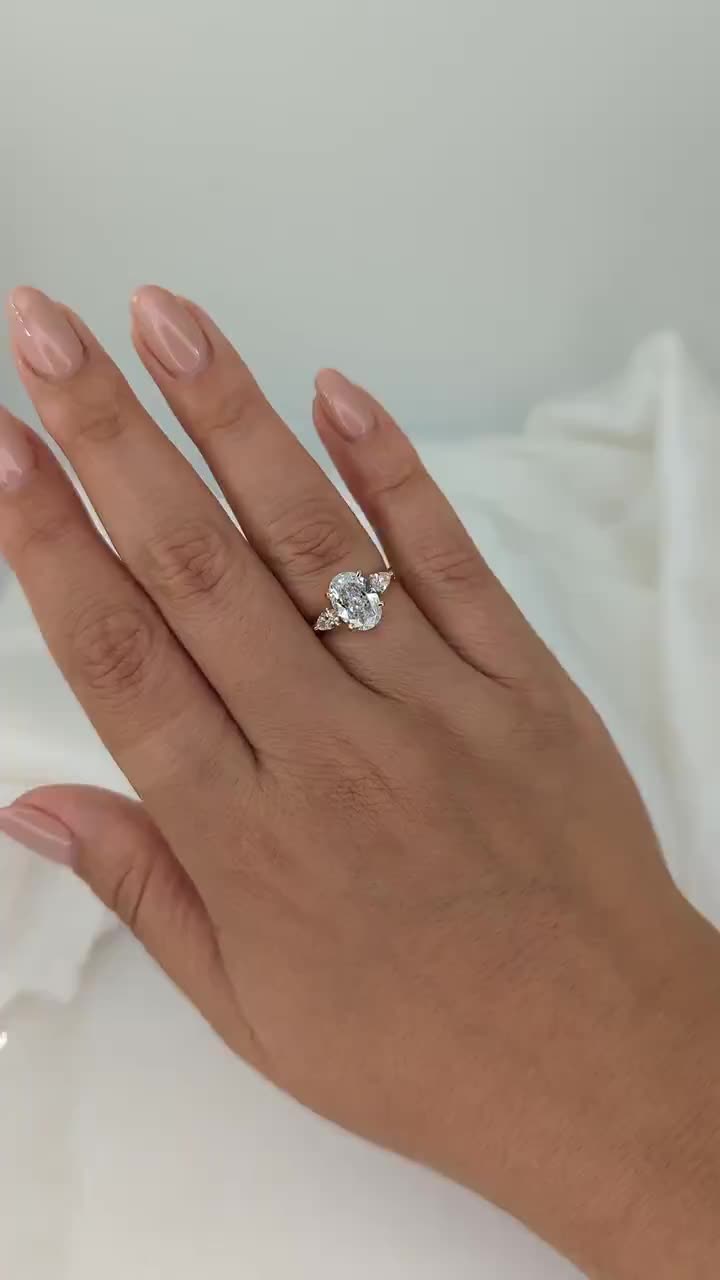 Low in stock, only 1 left Price:£6,150.06 Original Price:£6,833.40 10% off Local taxes included (where applicable) 2.20 Carat Oval Diamond Engagement Ring, 14K Yellow Gold With Side Pear Diamonds