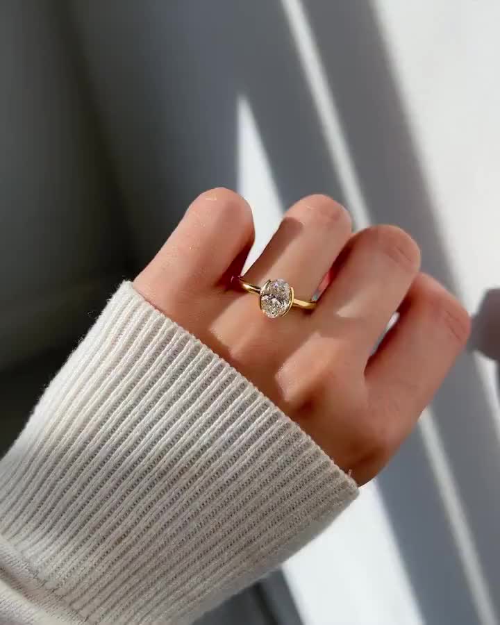 Low in stock, only 3 left NowPrice:£102.27+ Original Price:£127.84+ 20% off VAT included (where applicable) 1.20 CT Oval Cut Moissanite Engagement Ring, Half Bezel Set Solitaire Gold Ring, Modern Minimalist Ring, Dainty Promise Ring Gift for Her